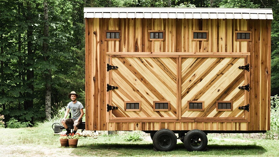 A homesteader Nathan Brown with his mobile solar kiln